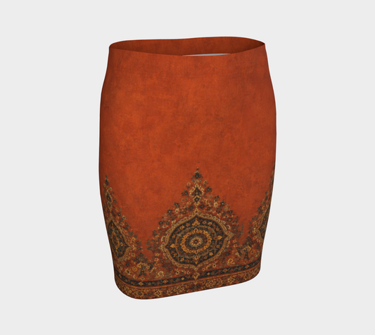An orange-brown textured skirt with a traditional ornate medallion pattern in dark brown, gold, and black along the hem and sides, shown on a light gray background.