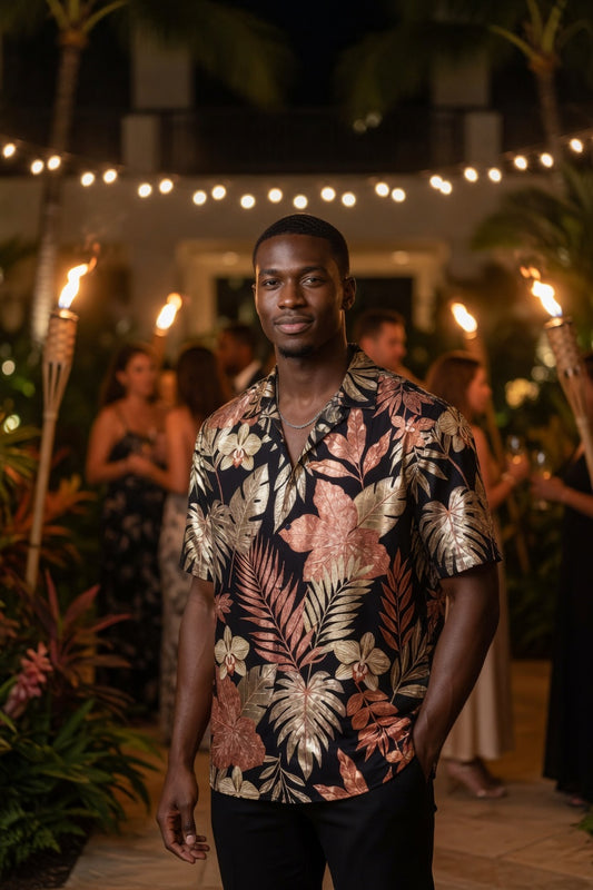 Man wearing a tropical patterned shirt in an outdoor setting with string lights and people in the background.