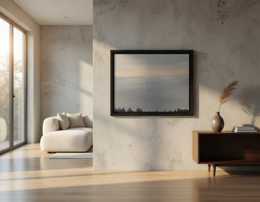 Modern living room with a framed landscape painting on a textured wall.